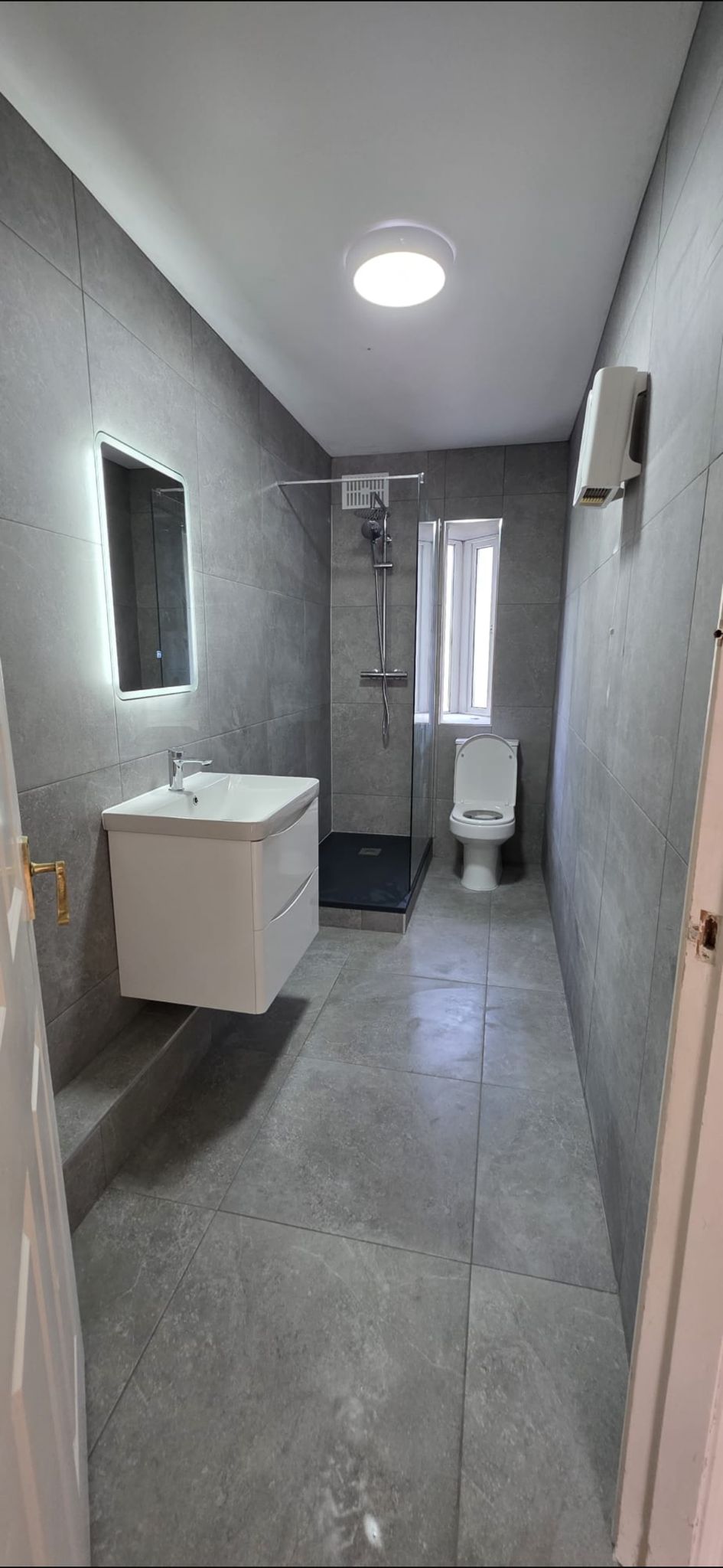 Bathroom after renovation by Kinsella